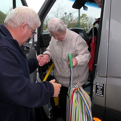 driver helping a passenger